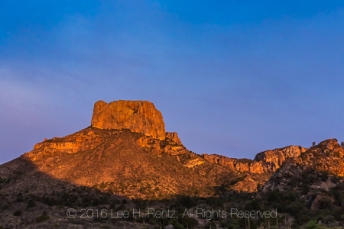 Dramatic sunset glow on iconic Casa Grande peak in the Chisos Mountains, viewed from Chisos Basin Campground, Big Bend National Park, Texas, USA